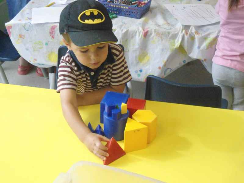 boy building with large blocks